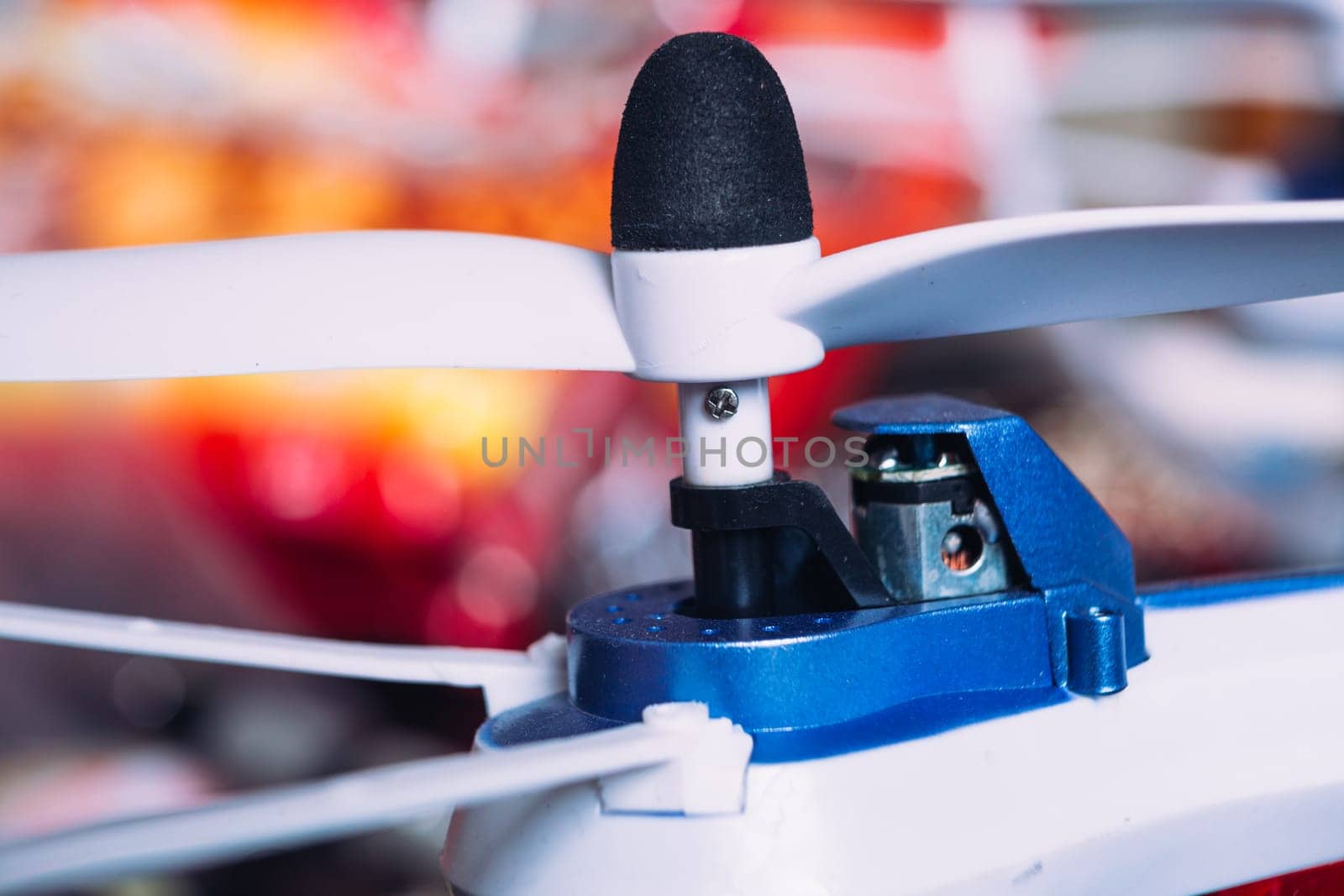 quadrocopters engine and propeller close to the blurred background