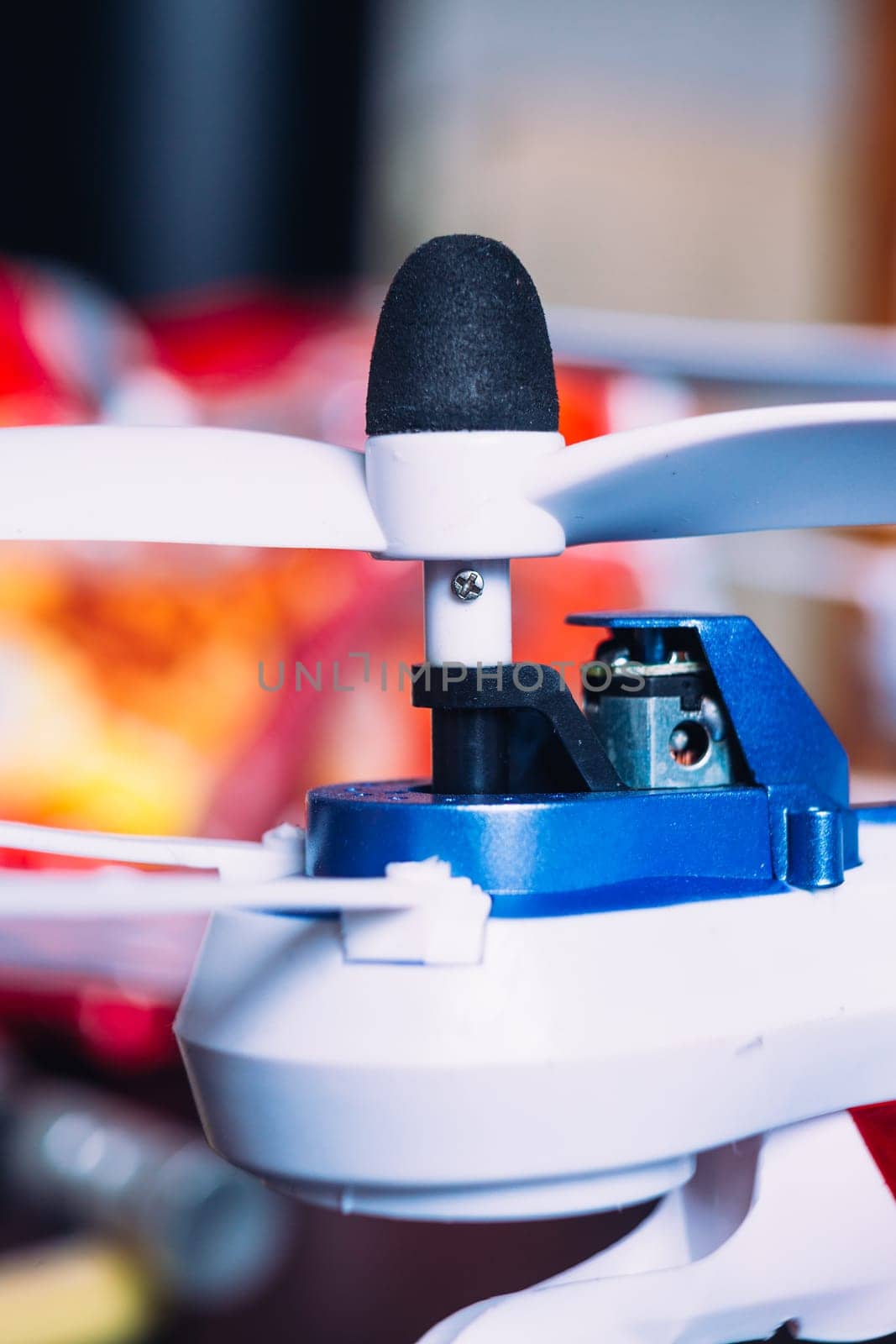 quadrocopters engine and propeller close to the blurred background