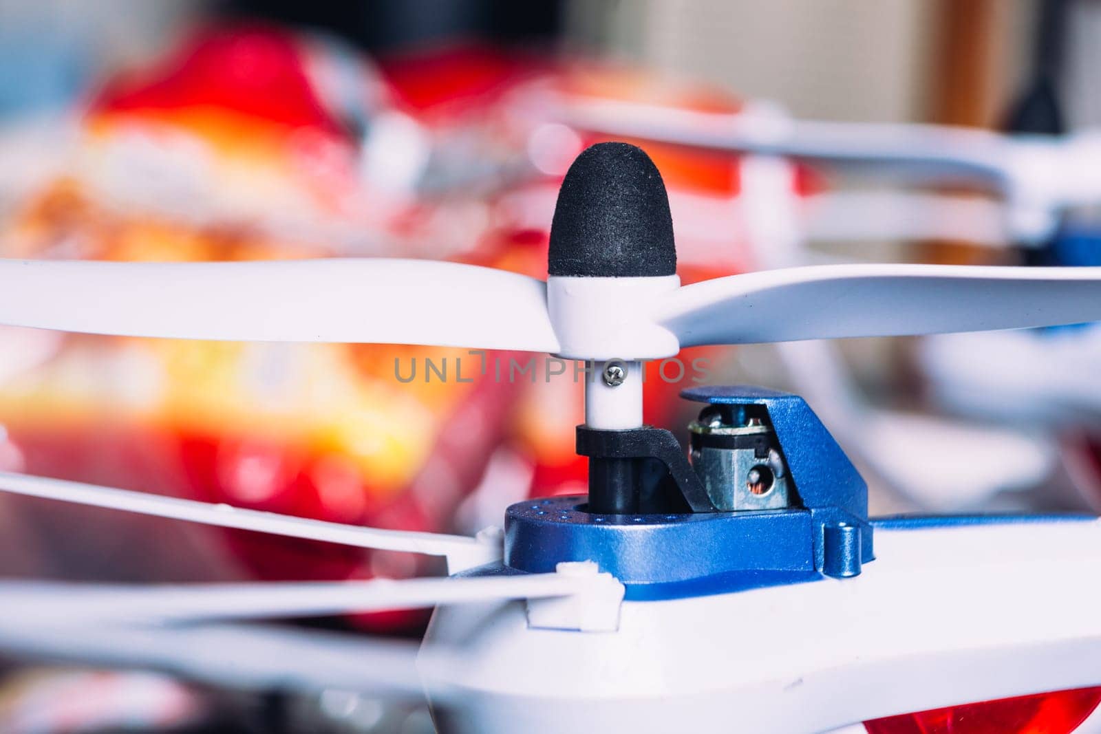 quadrocopters engine and propeller close to the blurred background