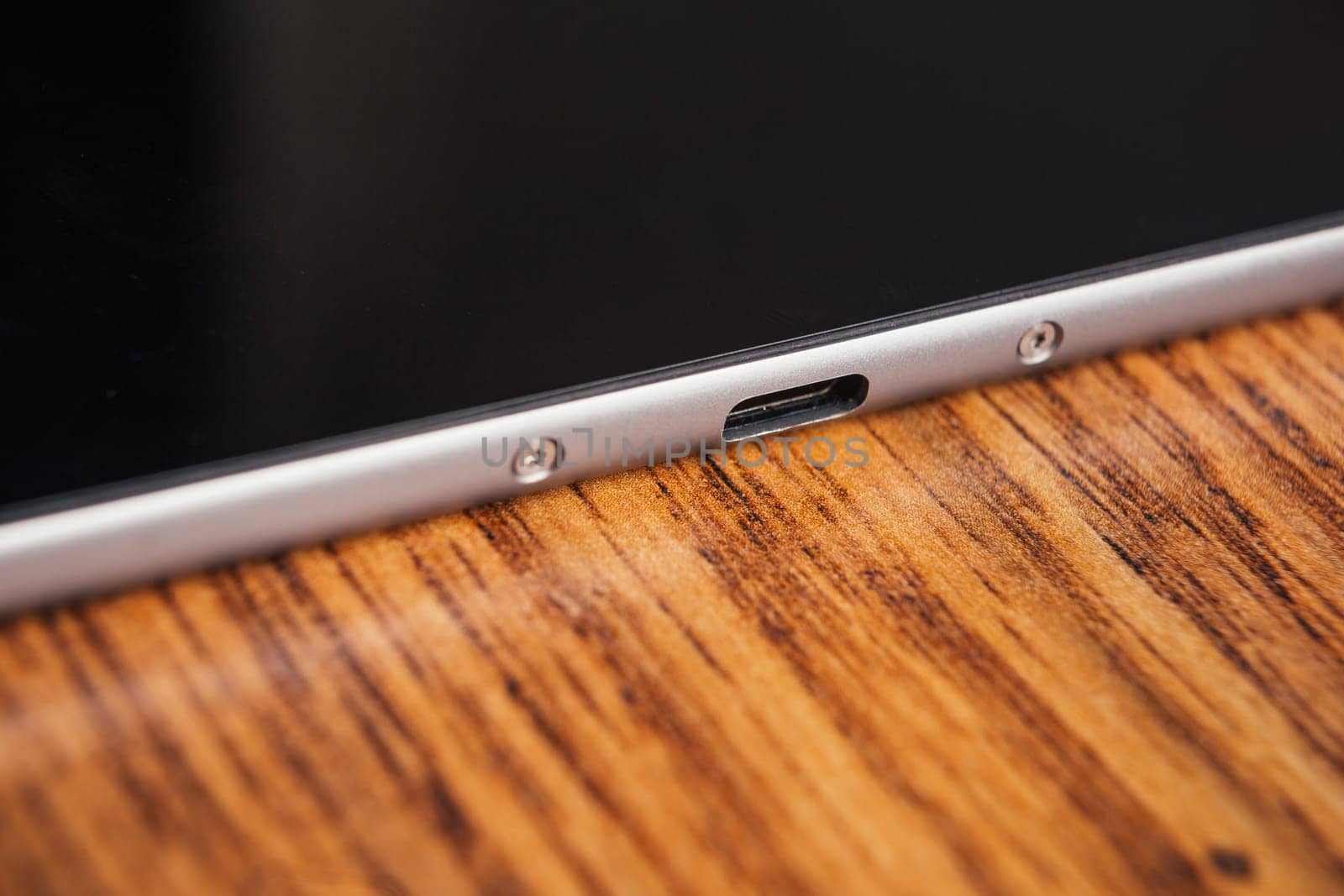 new tablet with built-in usb-c on wooden background