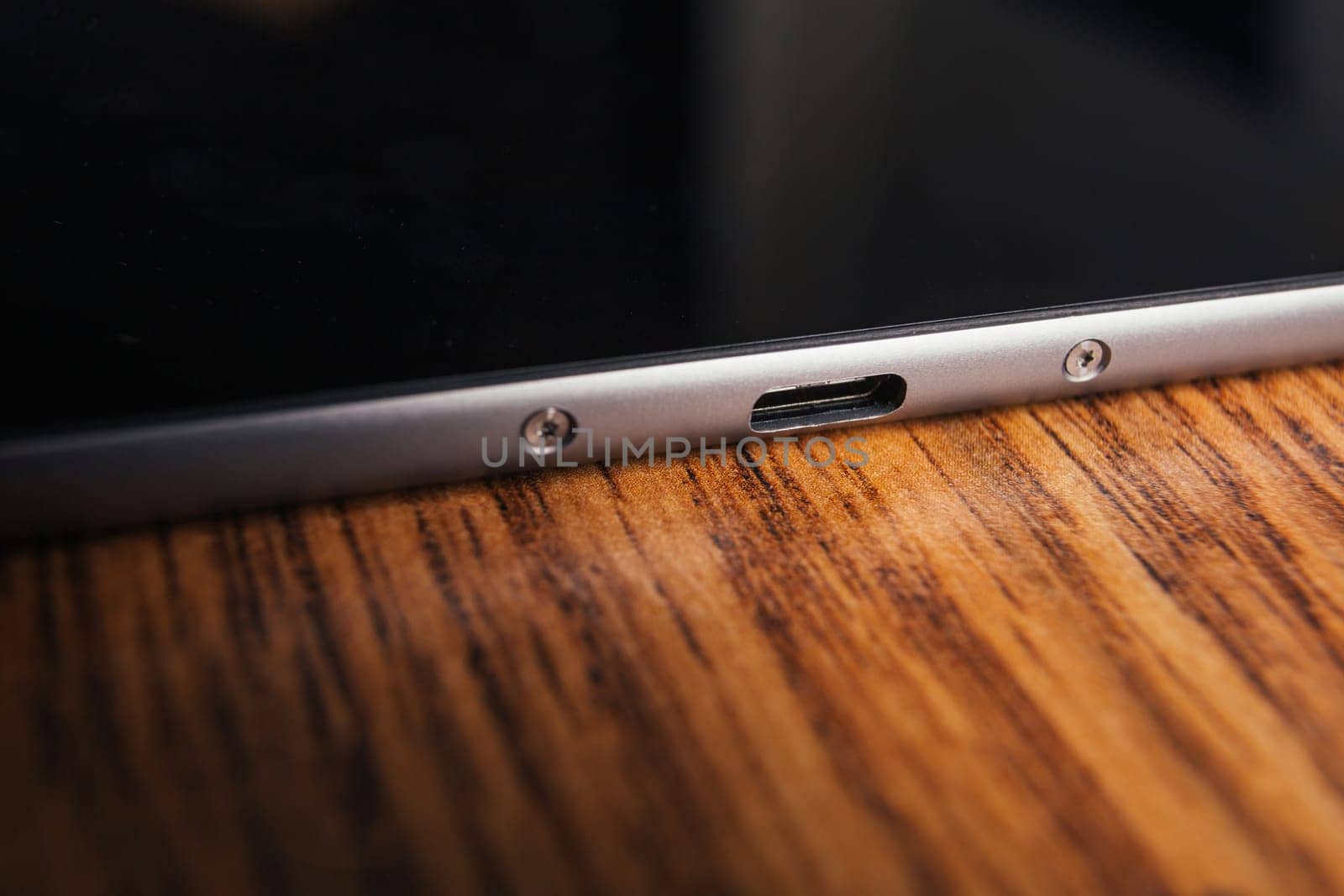 new tablet with built-in usb-c on wooden background