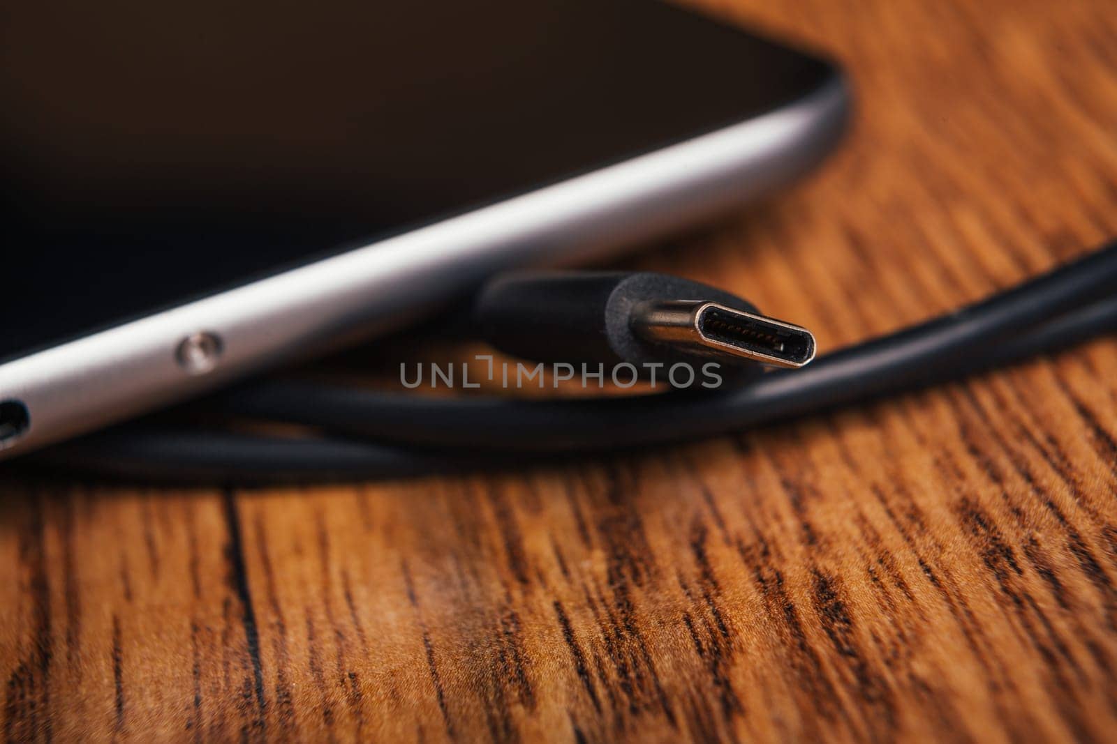 new tablet with built-in usb-c on wooden background