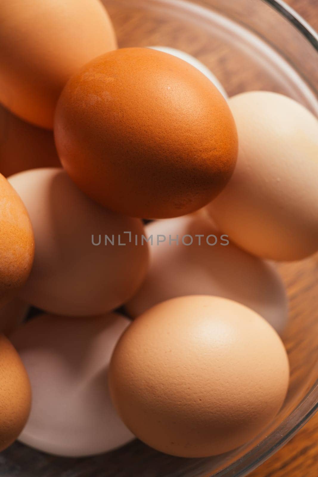 fresh rural eggs in a clear bowl