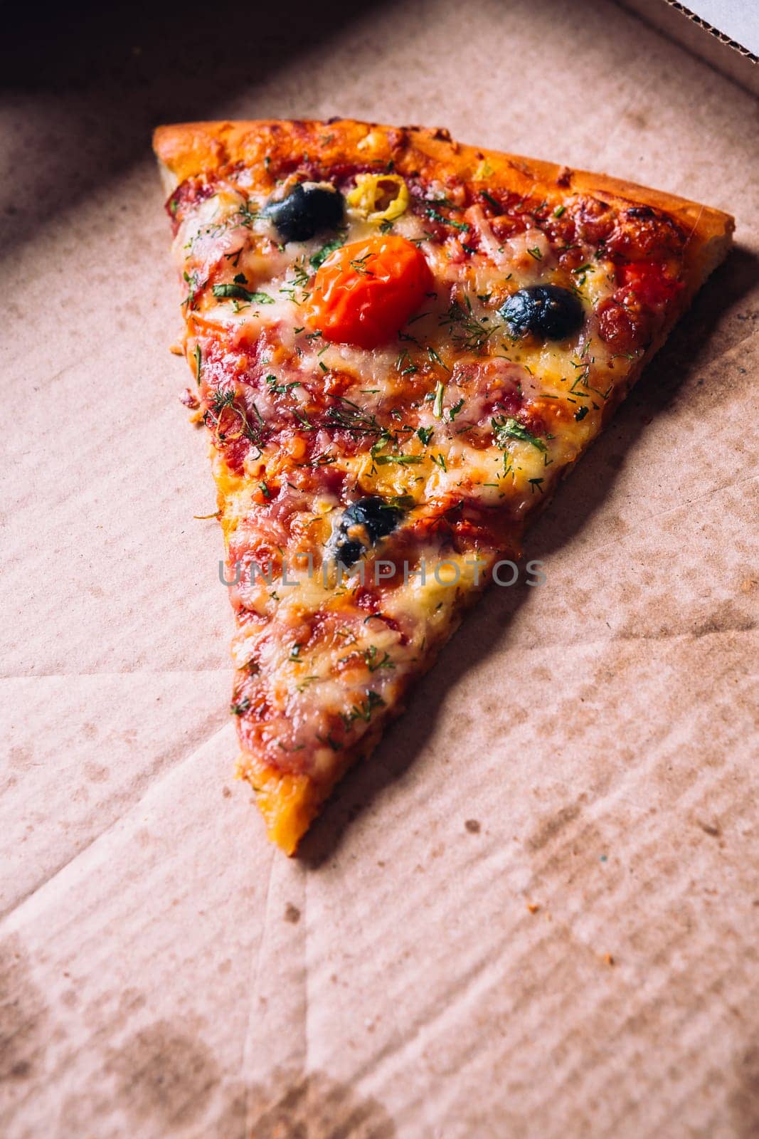 pieces of pizza with olives, cheese and salami sausage
