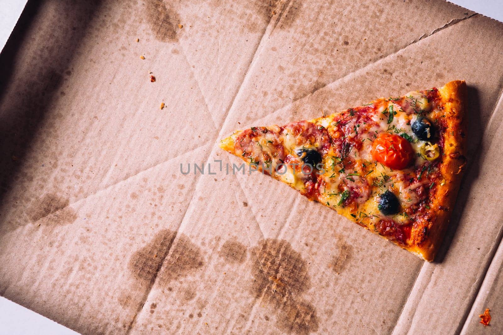 pieces of pizza with olives, cheese and salami sausage