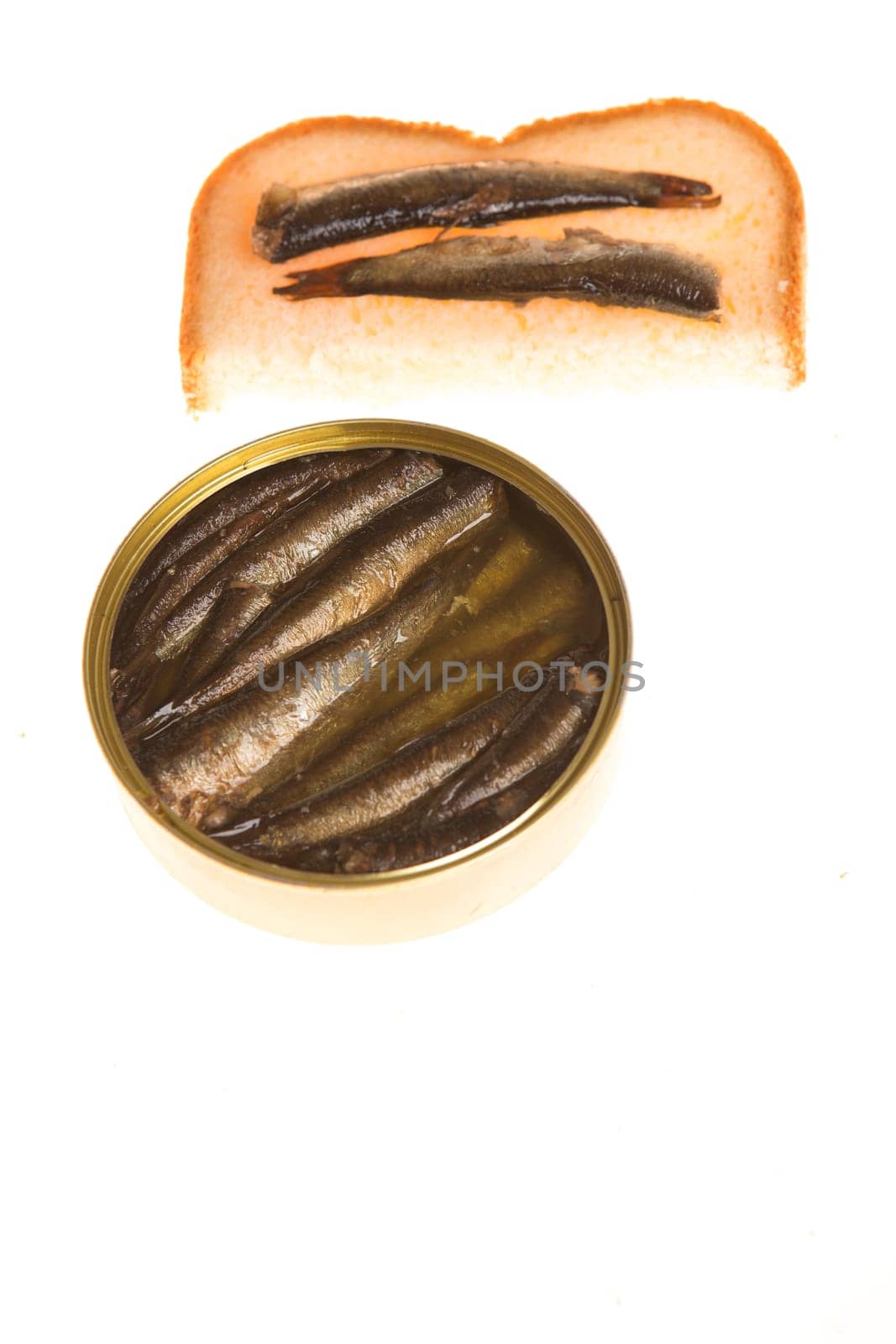 Open can and sandwich of sprats on a isolated background