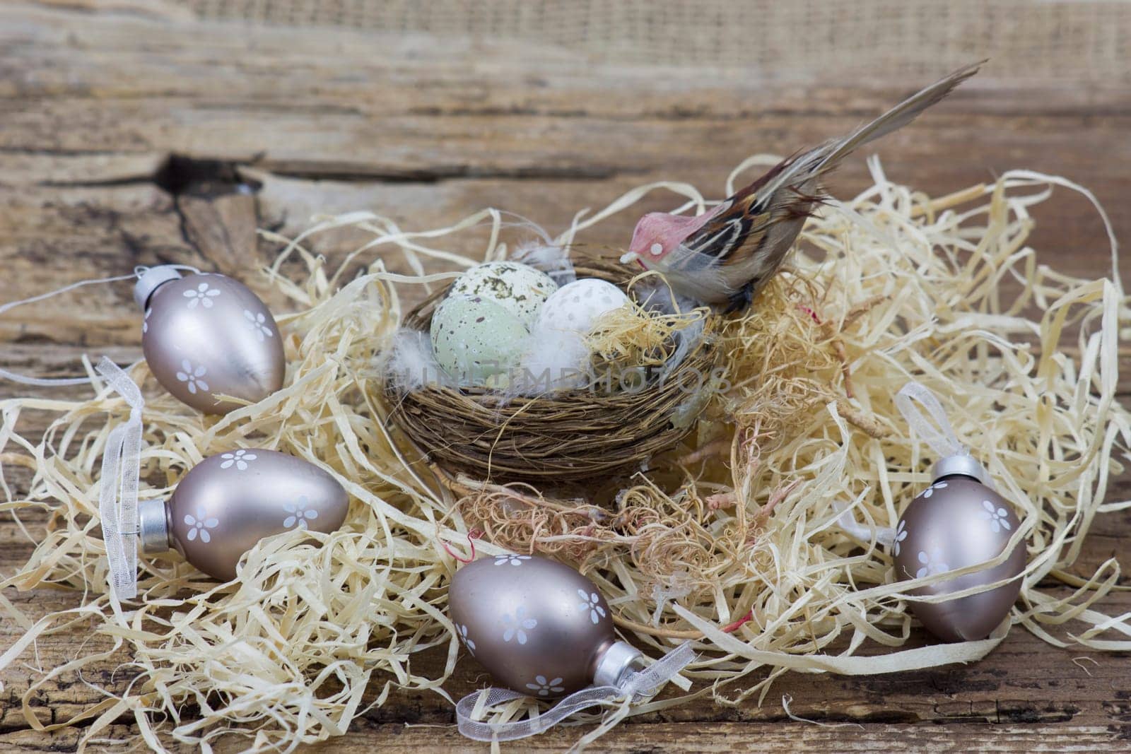 Easter decoration -  eggs in nest and bird