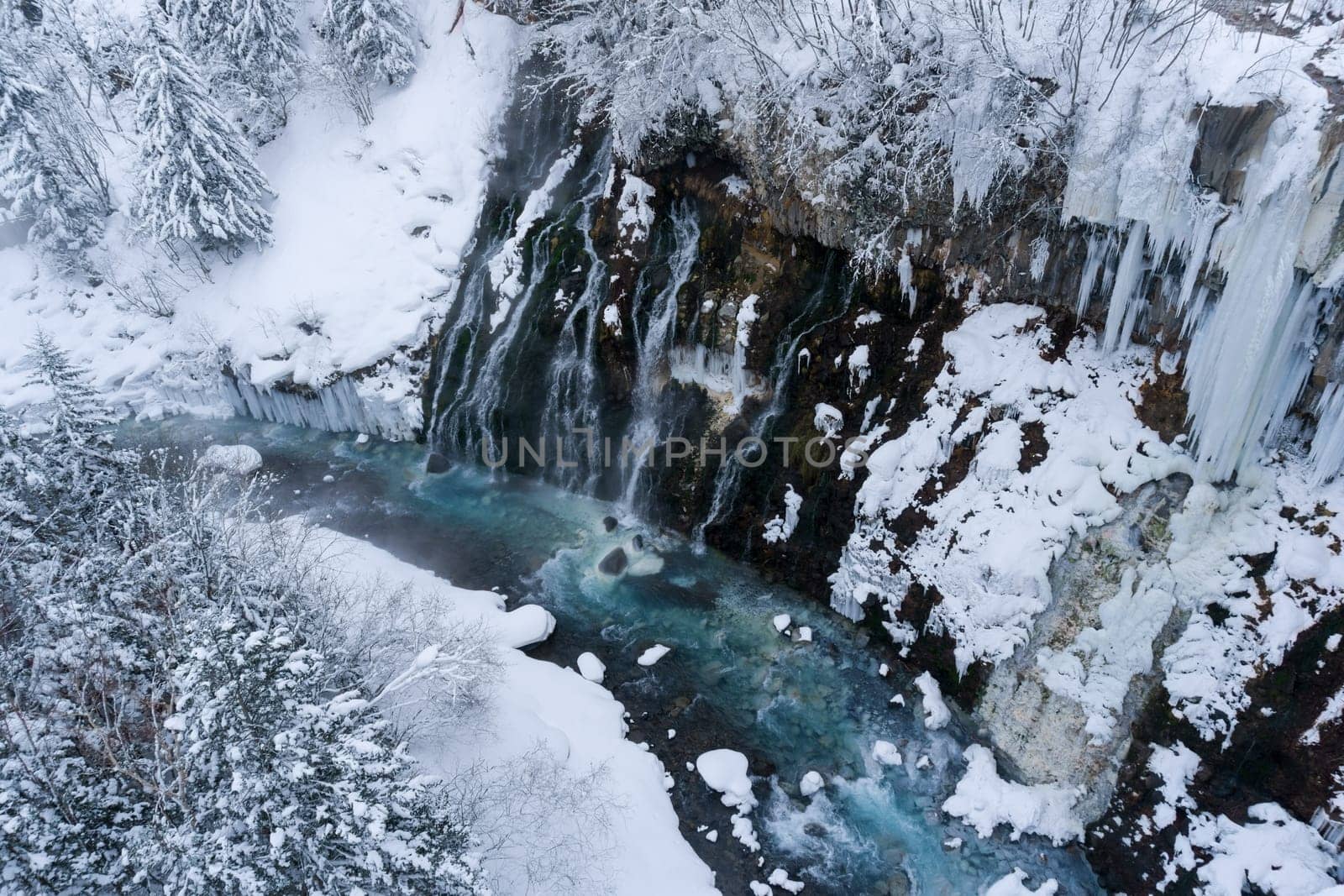 shirahige waterfall located 600 meters above sea leven in the Shirogane hot spring village of Biei City, this waterfall stands more than 30 meters tall. The water flowing down the gaps between the rocks resembles a white beard.