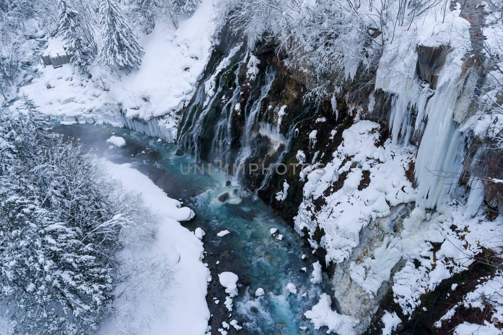 shirahige waterfall located 600 meters above sea leven in the Shirogane hot spring village of Biei City, this waterfall stands more than 30 meters tall. The water flowing down the gaps between the rocks resembles a white beard.