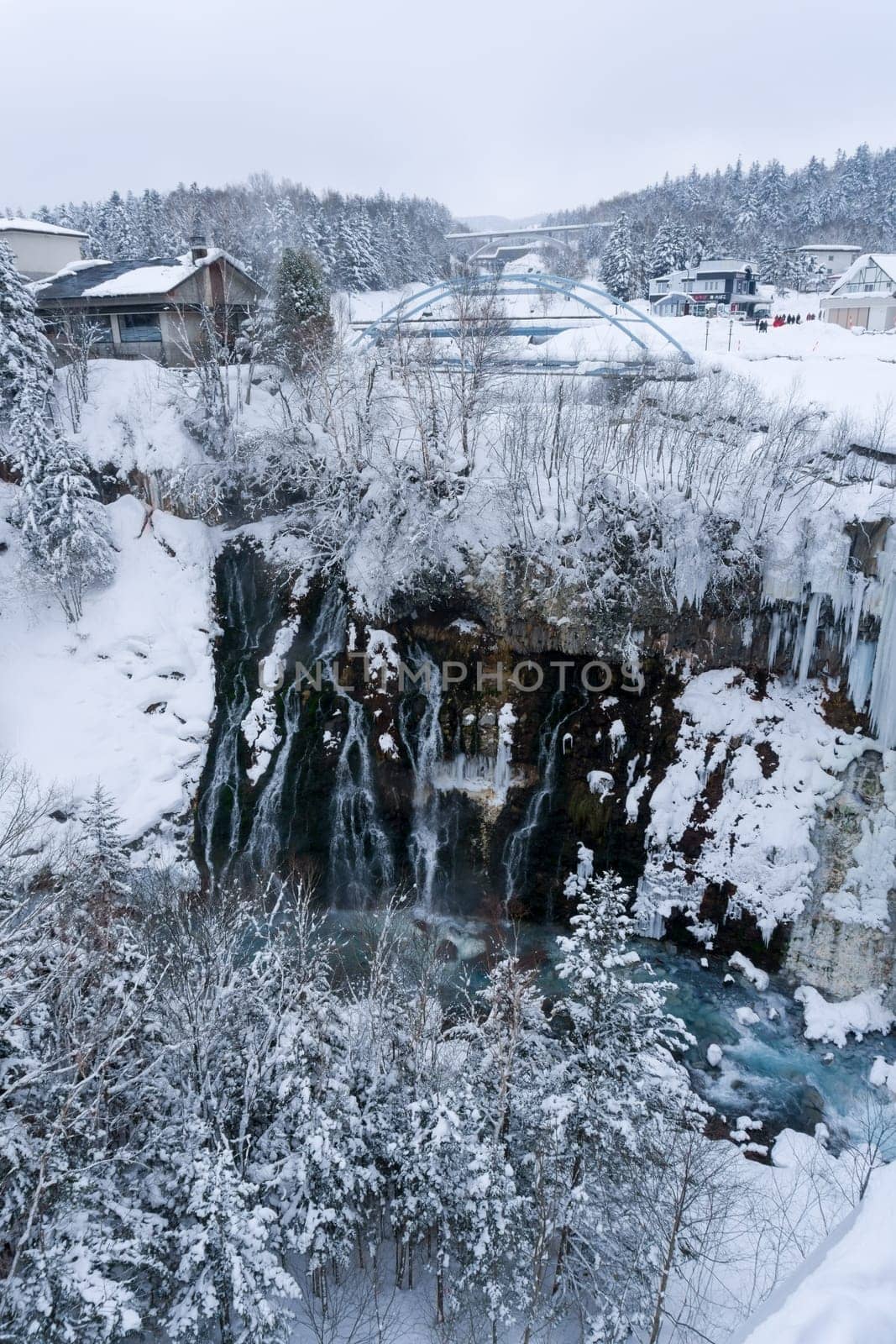 shirahige waterfall located 600 meters above sea leven in the Shirogane hot spring village of Biei City, this waterfall stands more than 30 meters tall. The water flowing down the gaps between the rocks resembles a white beard.