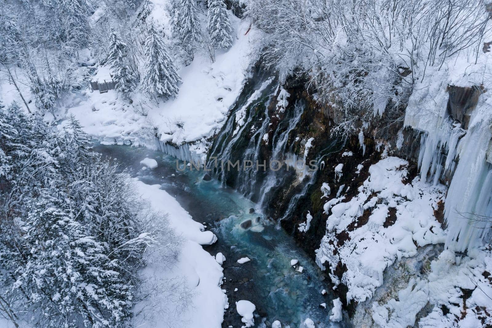 shirahige waterfall located 600 meters above sea leven in the Shirogane hot spring village of Biei City, this waterfall stands more than 30 meters tall. The water flowing down the gaps between the rocks resembles a white beard.