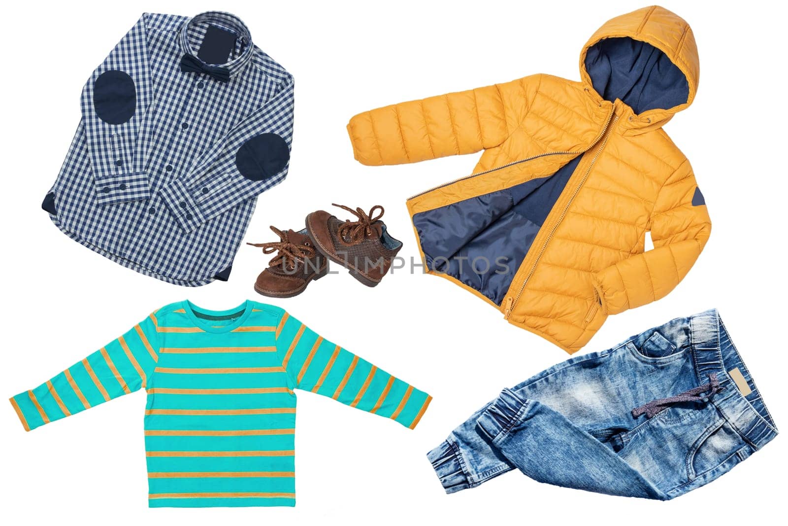 Top view on child boy set of clothes. Collage of apparel clothing. Jeans , shirt, shoes and warm down jacket isolated on a white background. Autumn and winter fashion.