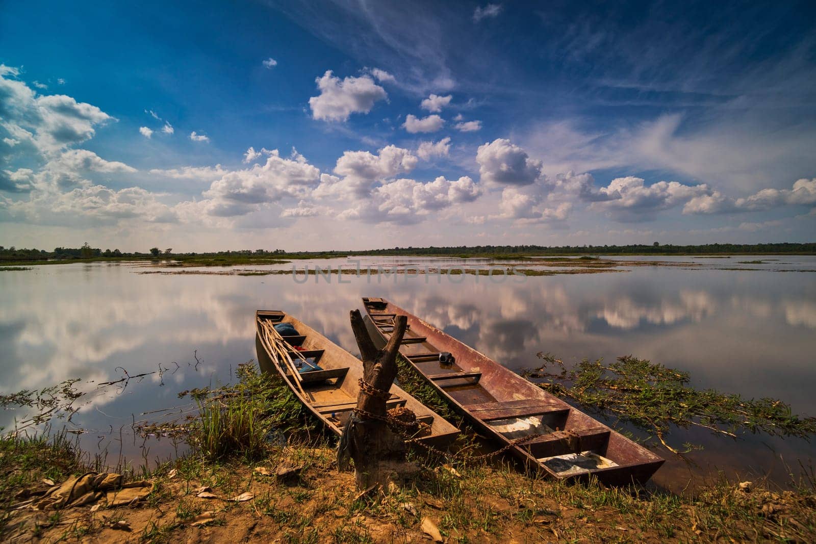Reflection Lake With Fishing Boat, idyllic landscape with sky and cumulus clouds