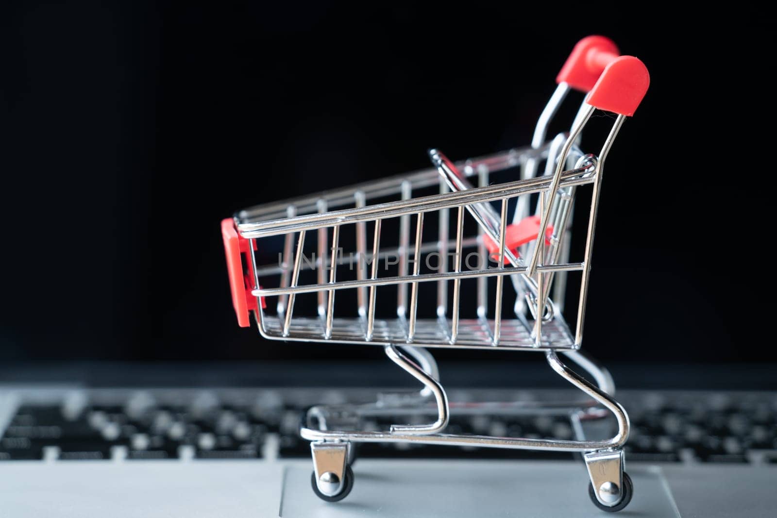 shopping cart on laptop, online shopping concept