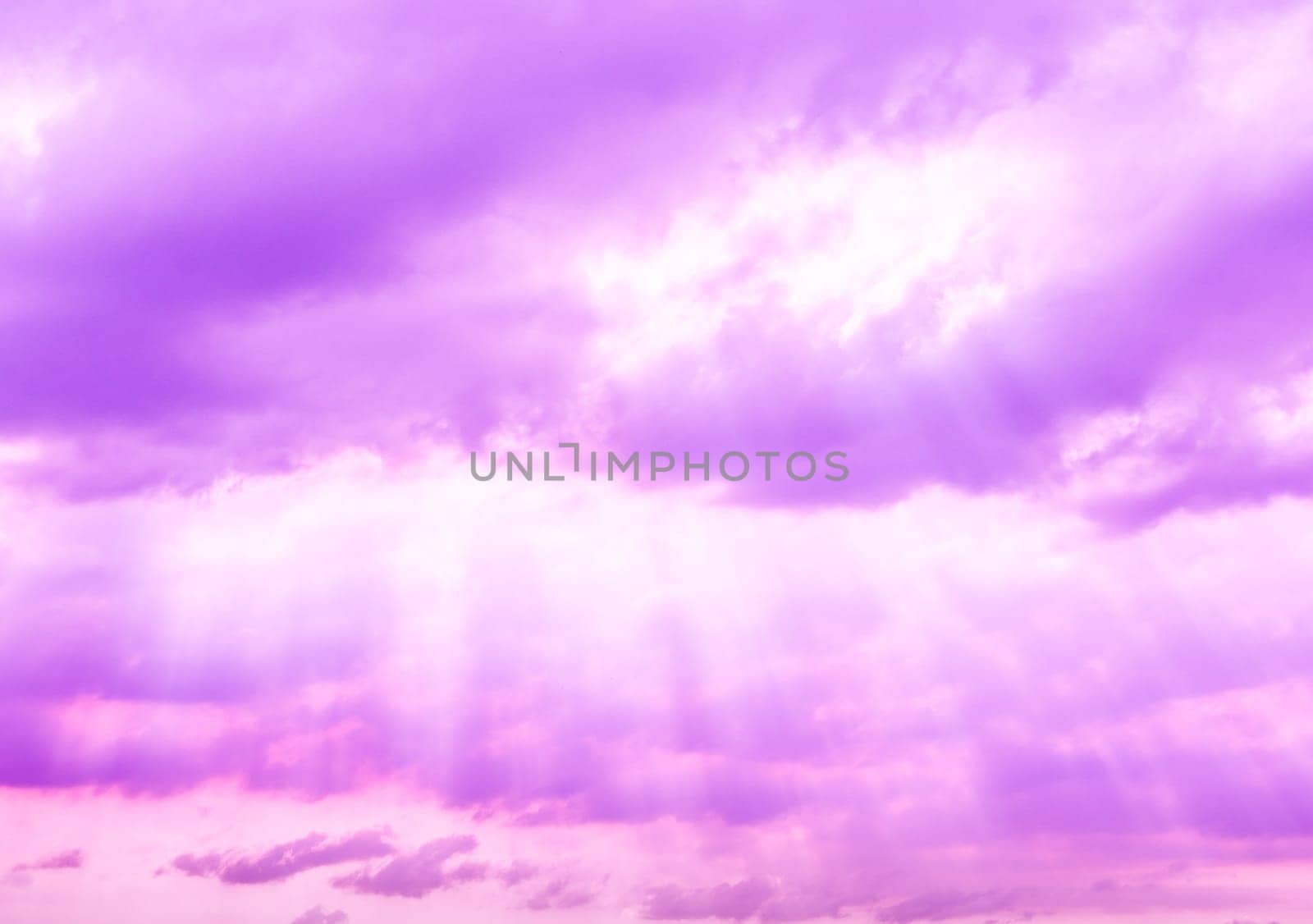 Purple fantasy sky with clouds and light shining through