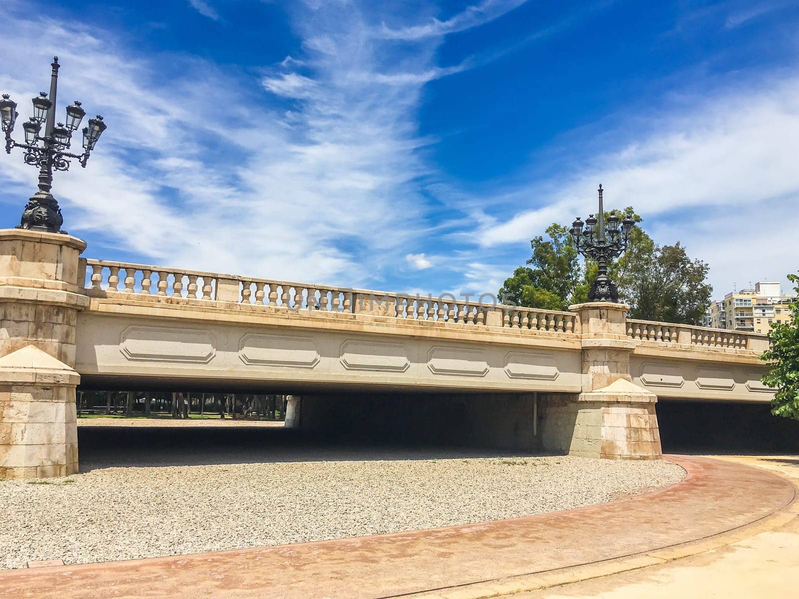 beautiful stone bridge in turia park Spain with road
