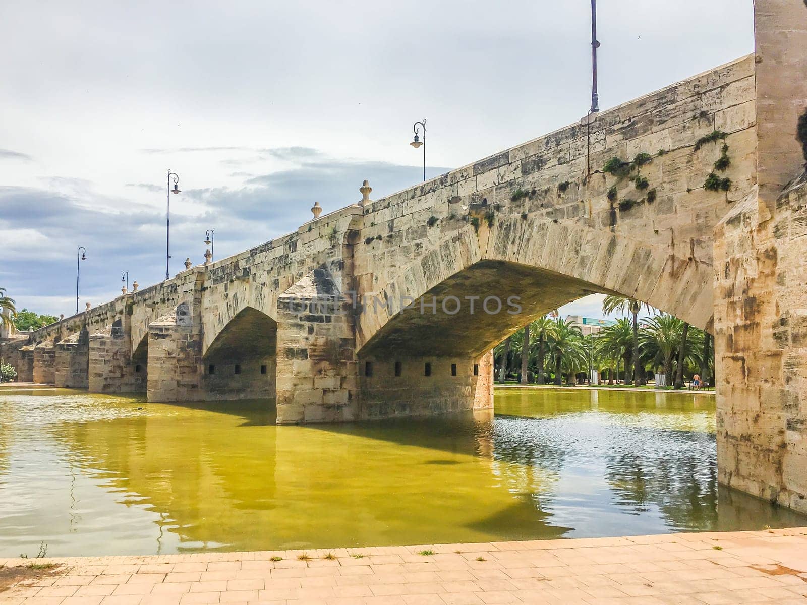 Old historic looking bridge with water