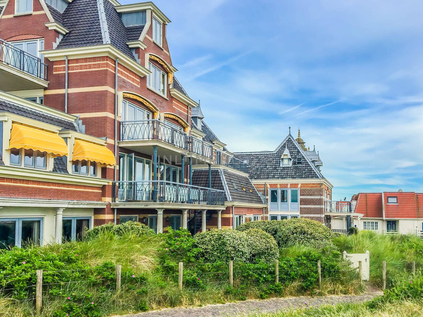 beautiful old vintage stylish house buildings with walking track and plants at Domburg the Netherlands