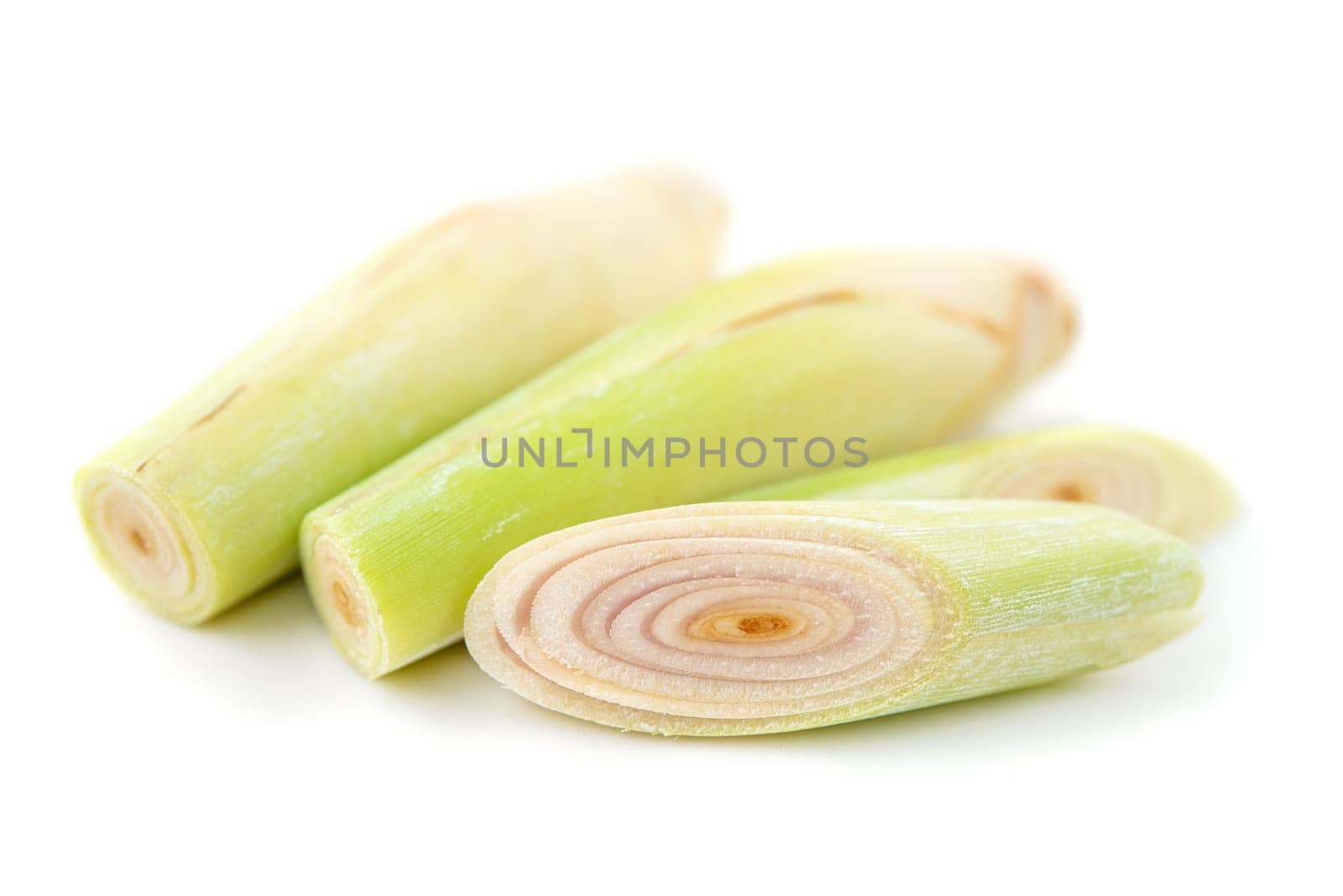 Fresh green lemongrass slices isolated on white background.