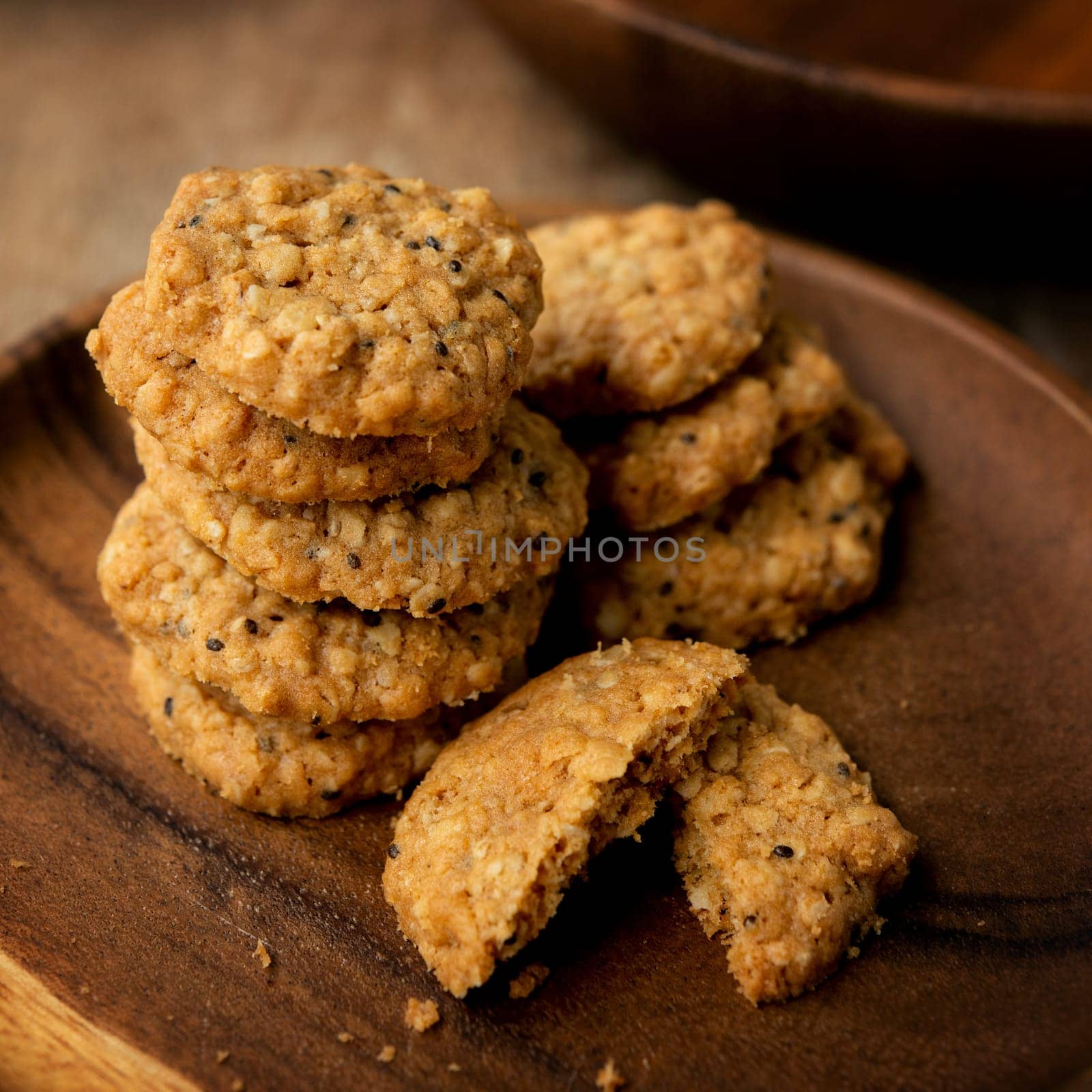 Vegan oatmeal chiaseeds cookies on plate with natural light.