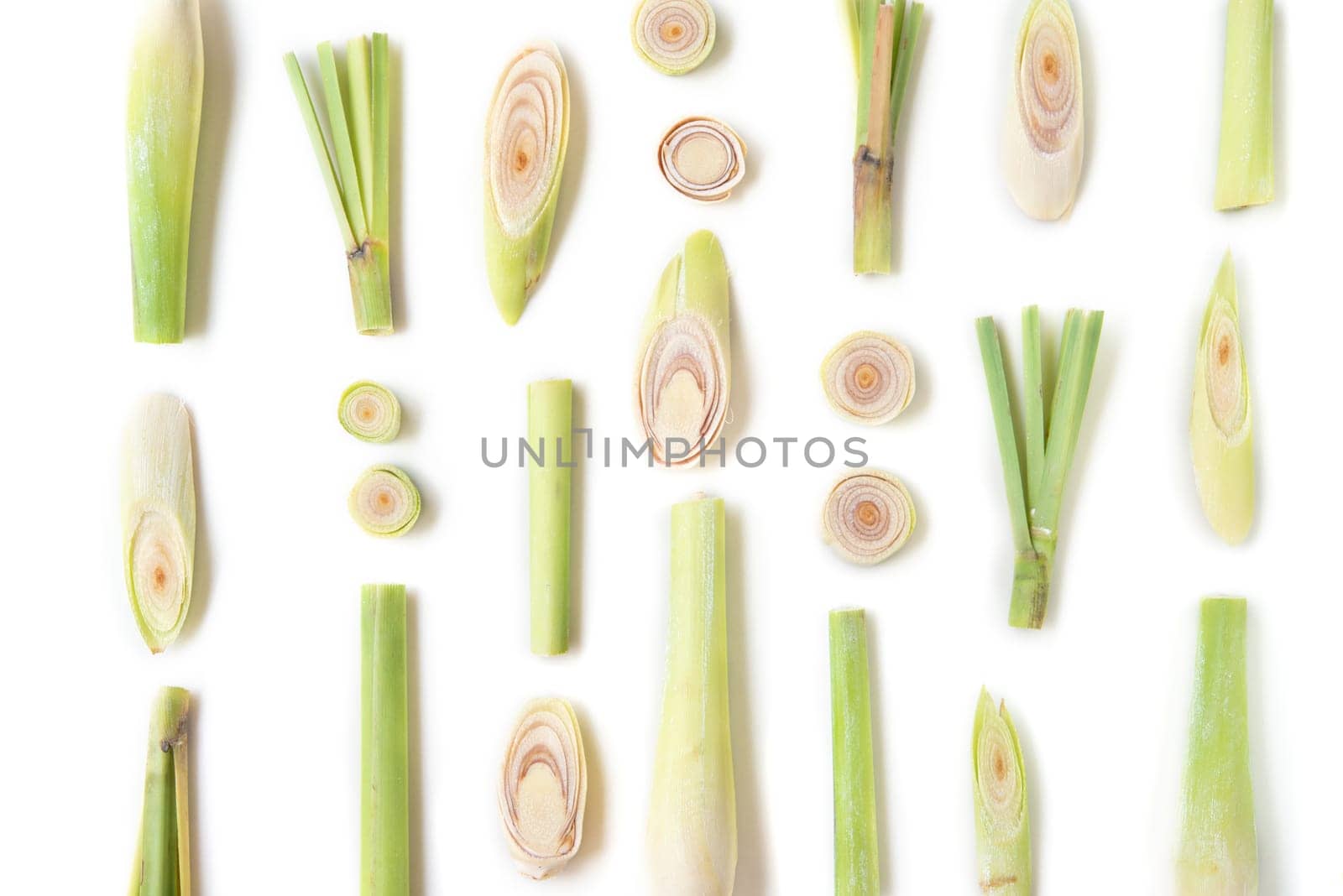 Fresh green lemongrass slices isolated on white background.