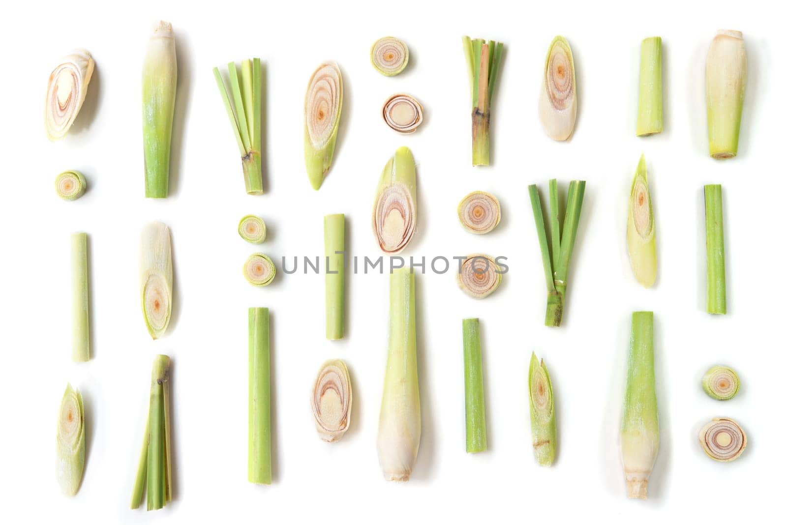 Fresh green lemongrass slices isolated on white background.