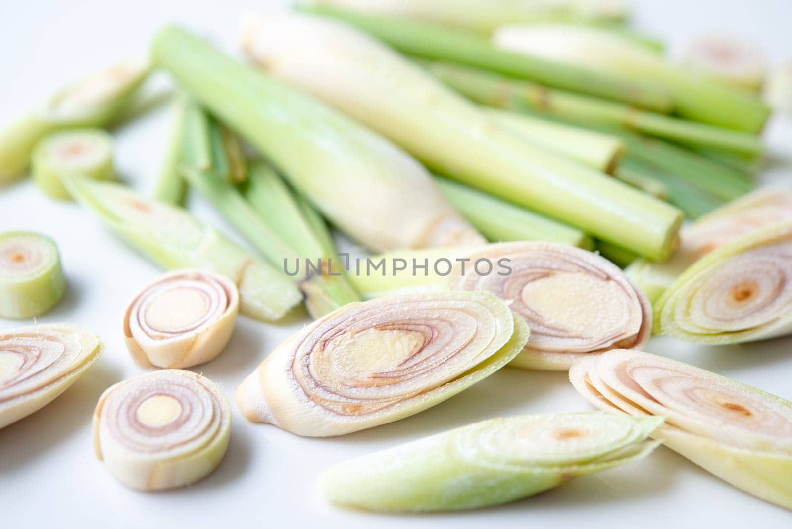 Fresh green lemongrass slices isolated on white background.