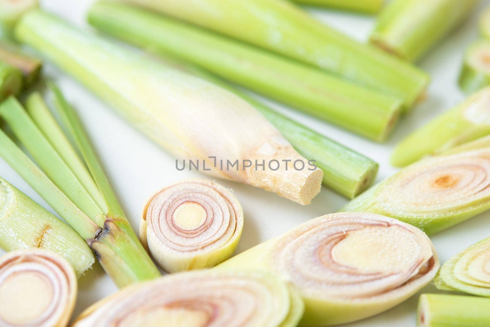 Fresh green lemongrass slices isolated on white background.