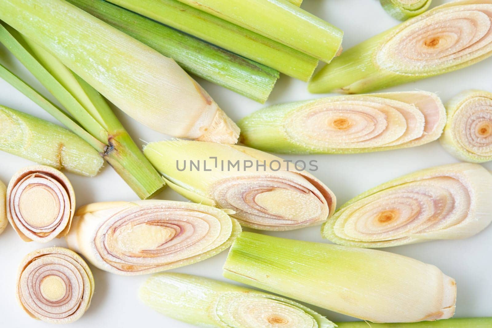 Fresh green lemongrass slices isolated on white background.