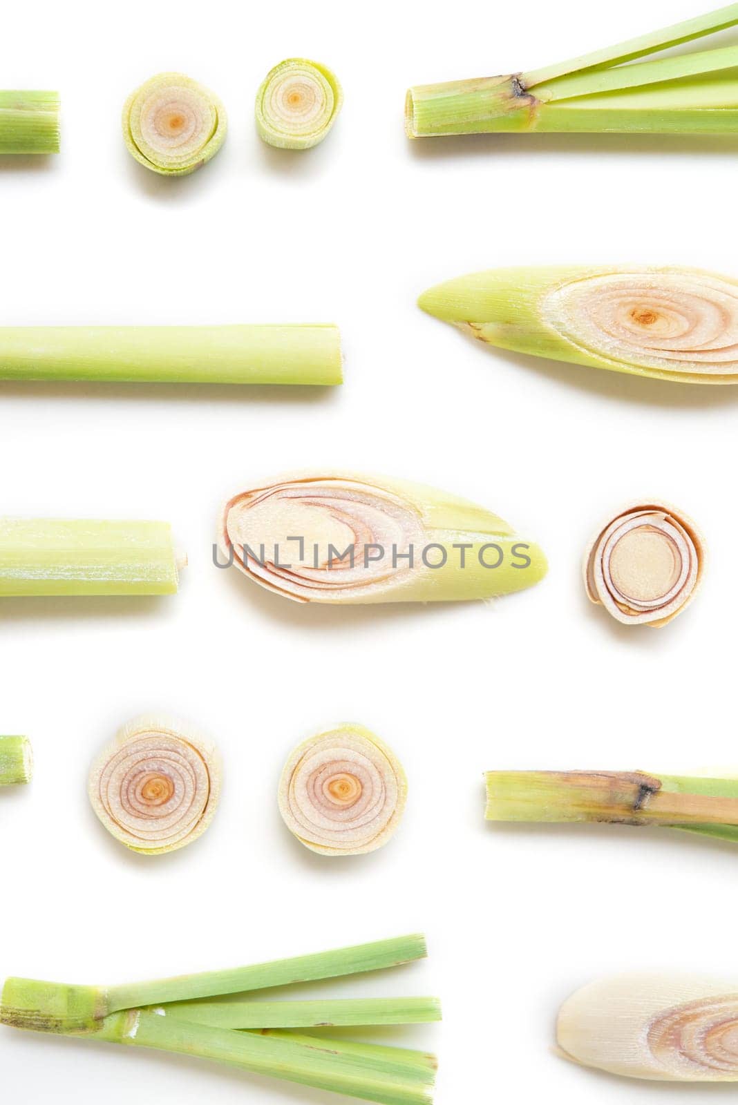Fresh green lemongrass slices isolated on white background.