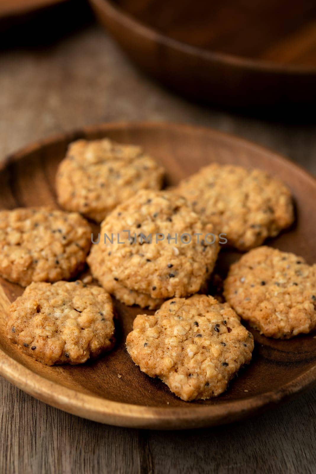Vegan oatmeal chiaseeds cookies on plate with natural light.