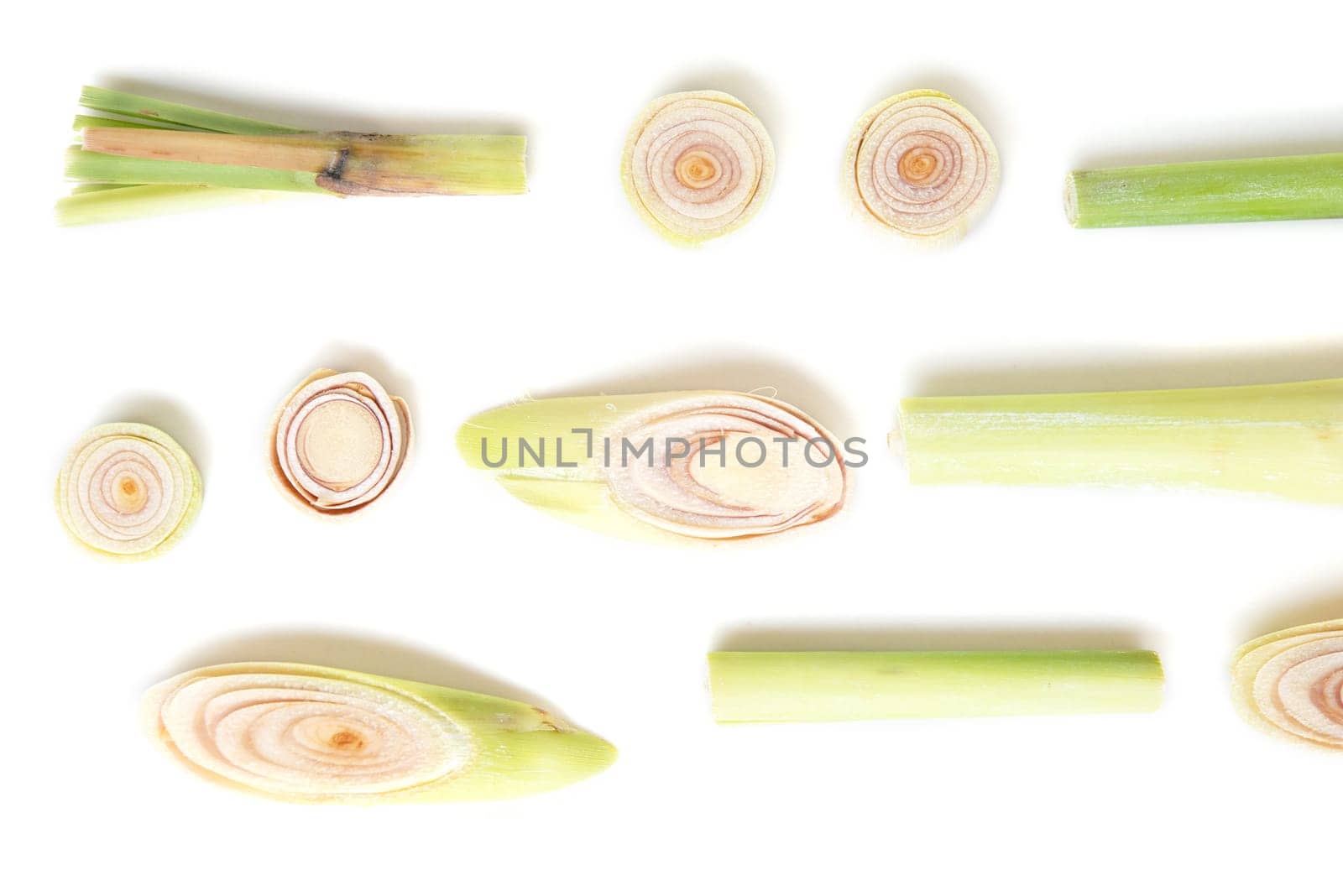 Fresh green lemongrass slices isolated on white background.
