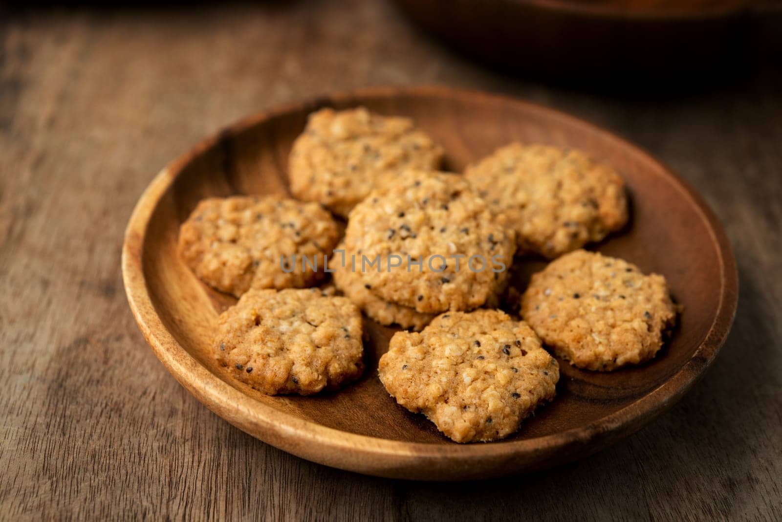 Vegan oatmeal chiaseeds cookies on plate with natural light.