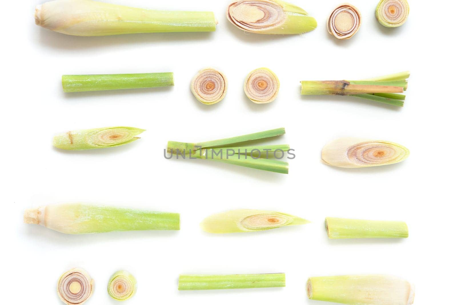 Fresh green lemongrass slices isolated on white background.