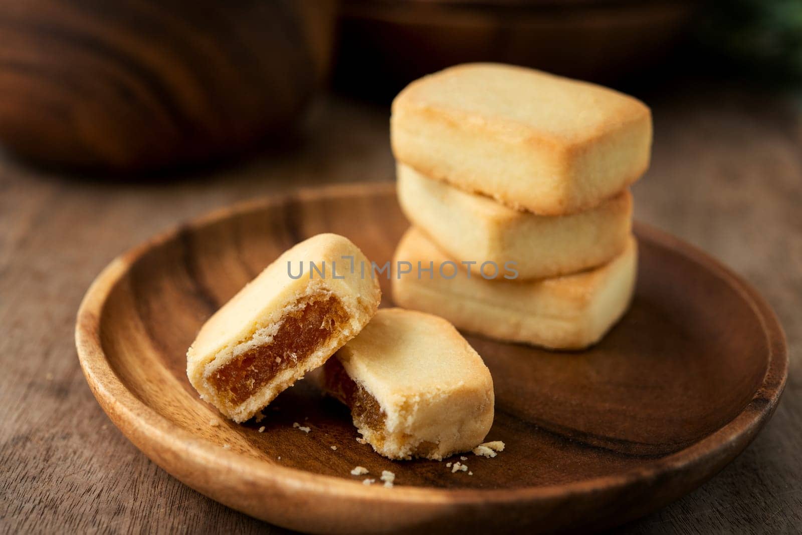 Pineapple cake is a sweet traditional Taiwanese pastry containing butter, flour, egg, sugar, and pineapple jam.