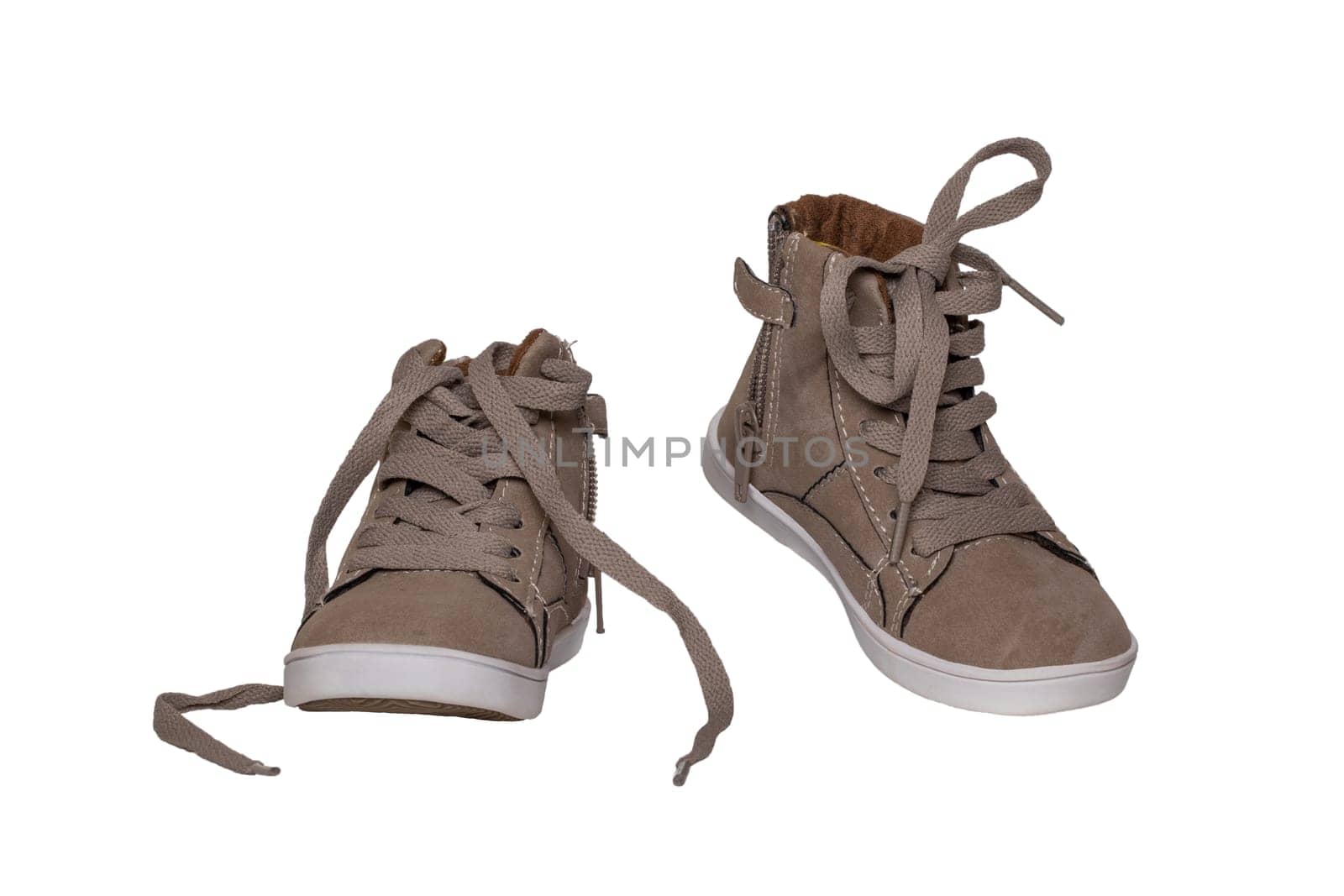 Winter boots and shoes. A pair brown suede winter boots isolated on a white background. Leather shoe fashion new collection winter 2018 to 2019.