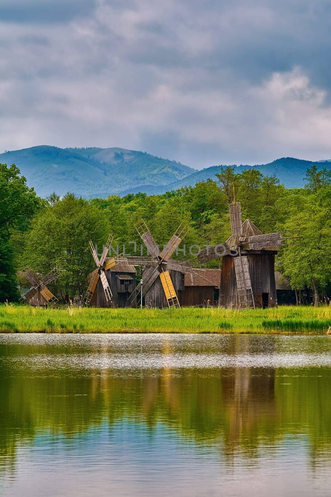 Windmills on the Bank of Lake in Romania