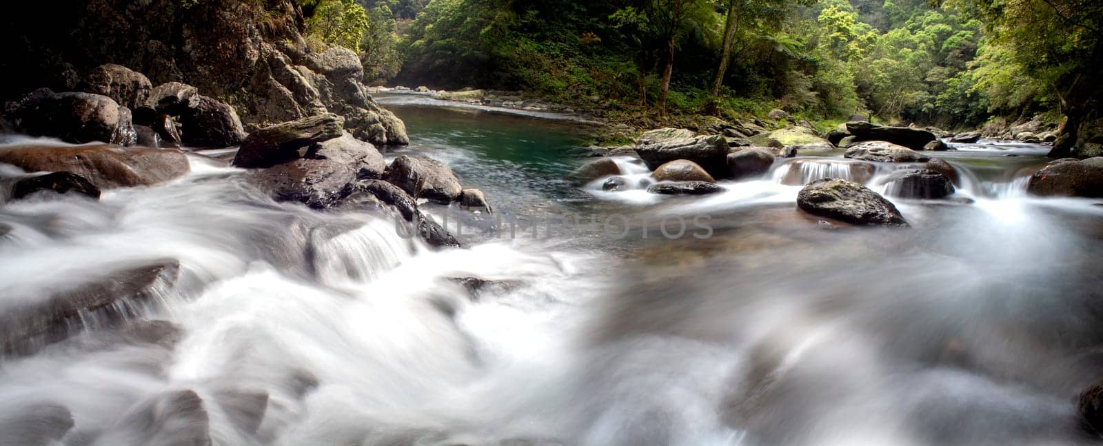 The Picture of some small waterfall at a nature river