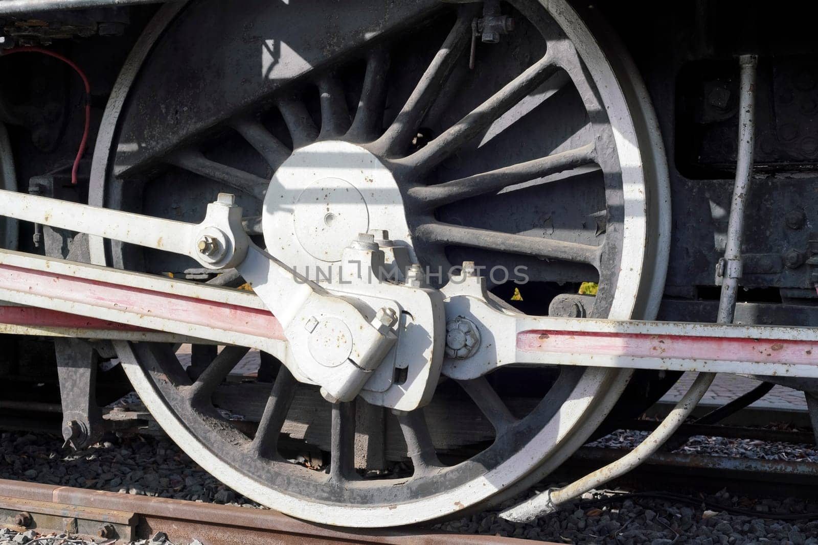 Wheels a closeup of the old locomotive with the steam engine on railway track