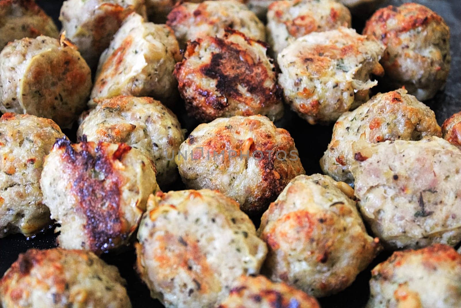 Closeup of freshly baked parmesan turkey meatballs.