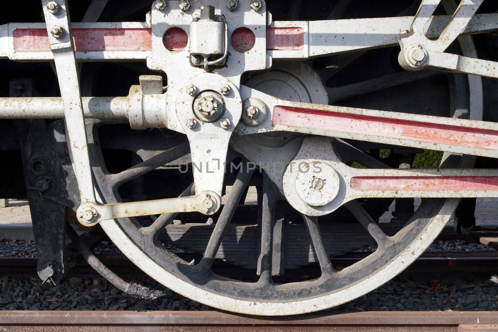 Wheels a closeup of the old locomotive with the steam engine on railway track