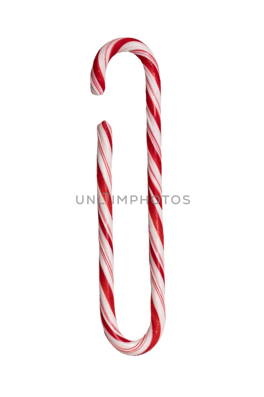 Traditional Christmas striped candy cane isolated on a white background. Top view.