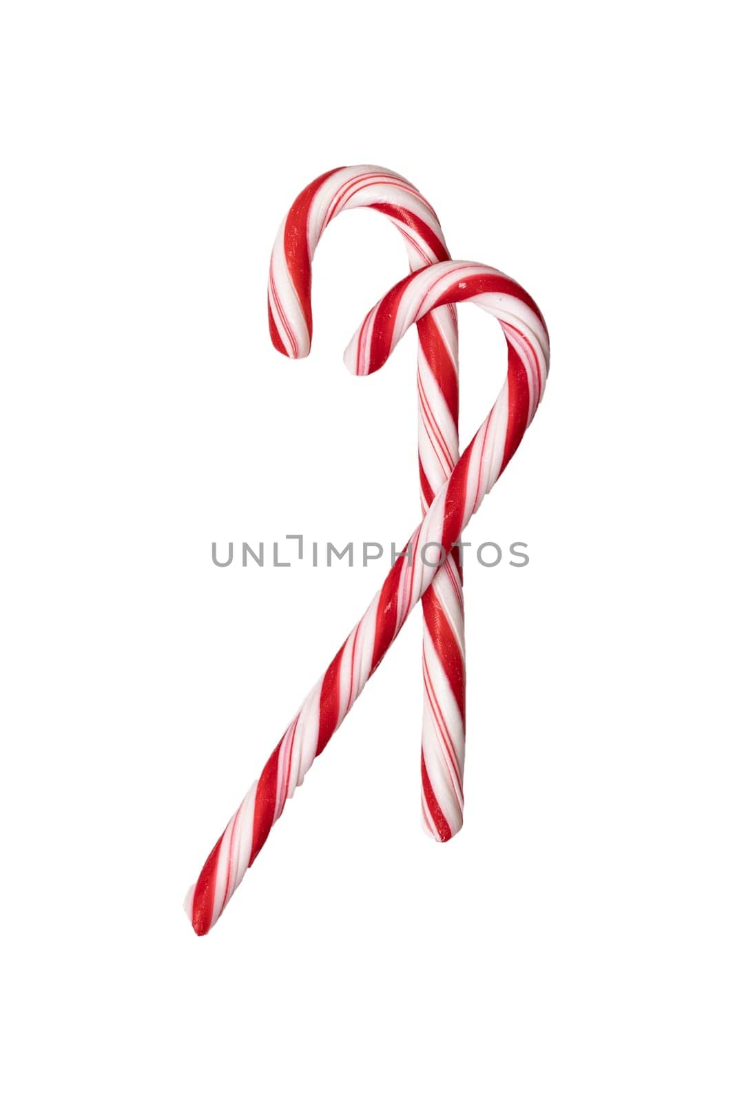 Traditional Christmas striped candy cane isolated on a white background. Top view.