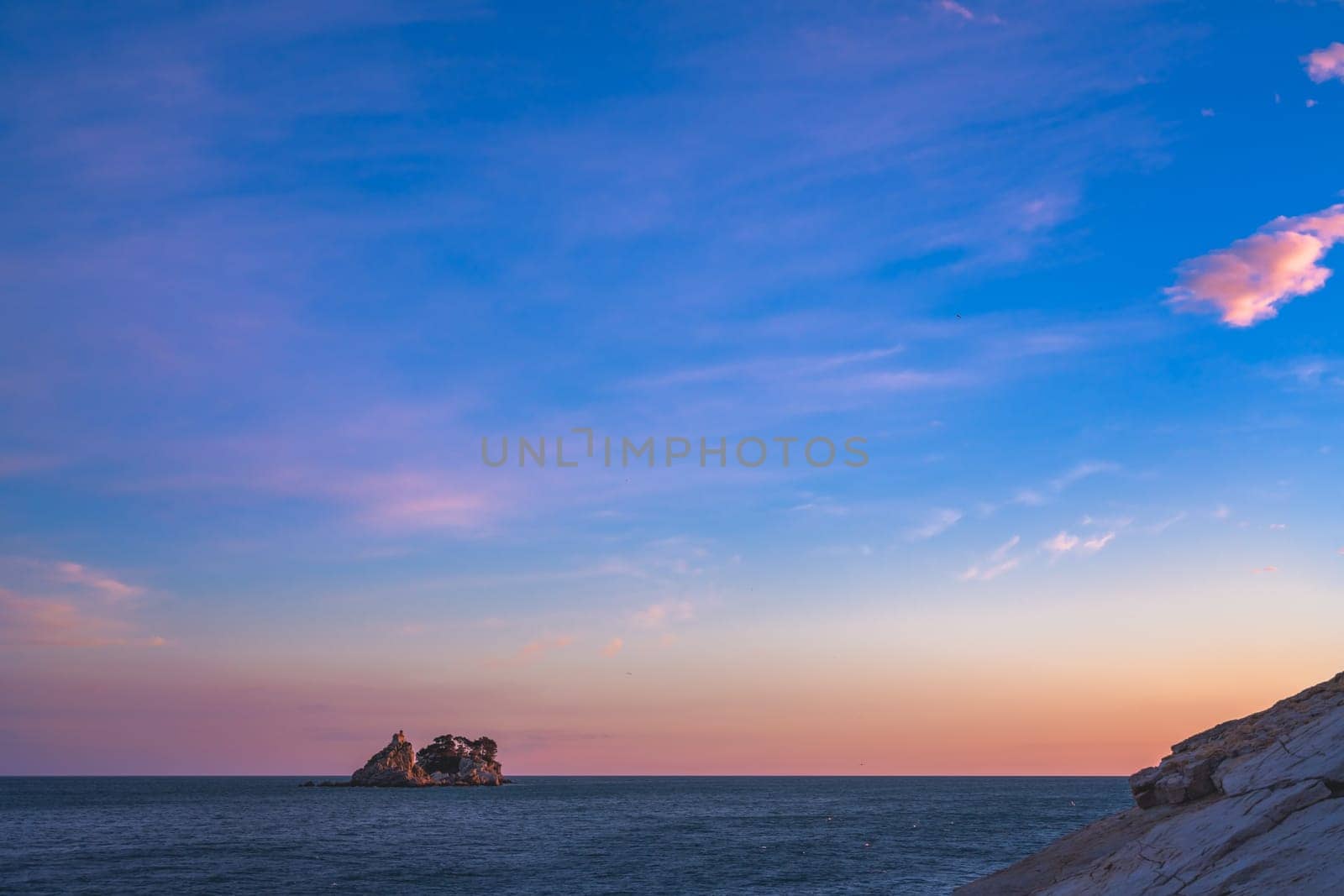 Small secluded monastery on the tiny rocky island in Petrovac bay in Montenegro, the Adriatic sea