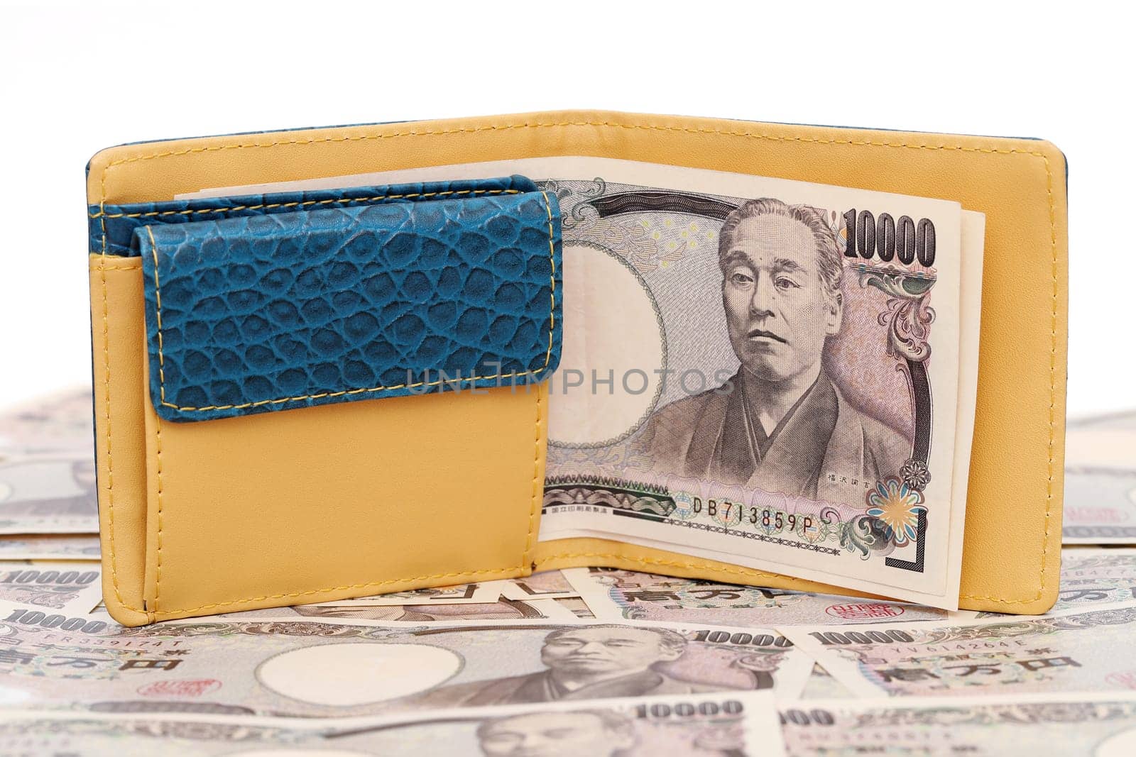 Leather wallet and ten thousand japanese yen on white background