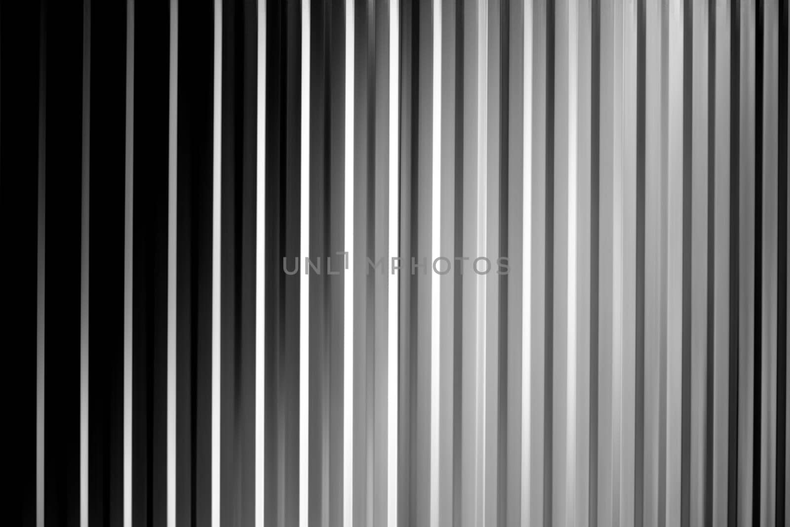 An abstract black white and gray striped surface with shadows and vignettes.....