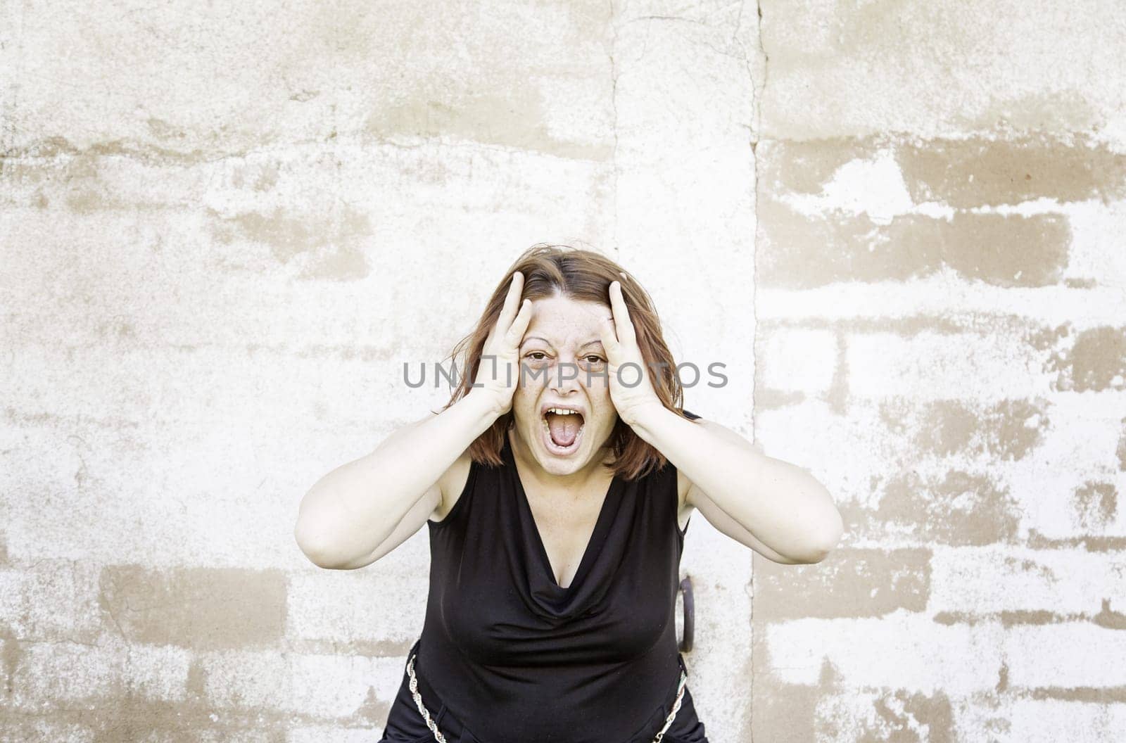 Girl screaming in urban street and crazy people