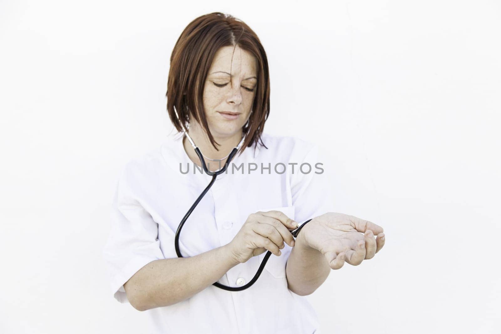 Nurse with stethoscope wearing gown, medicine and health