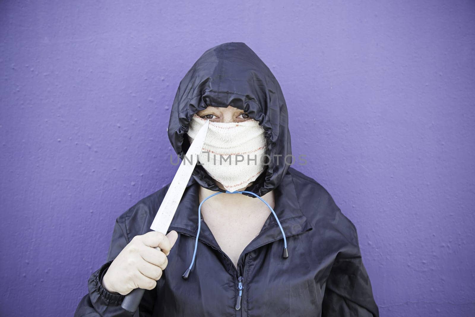 Aggressive hooded woman, violence and lifestyle