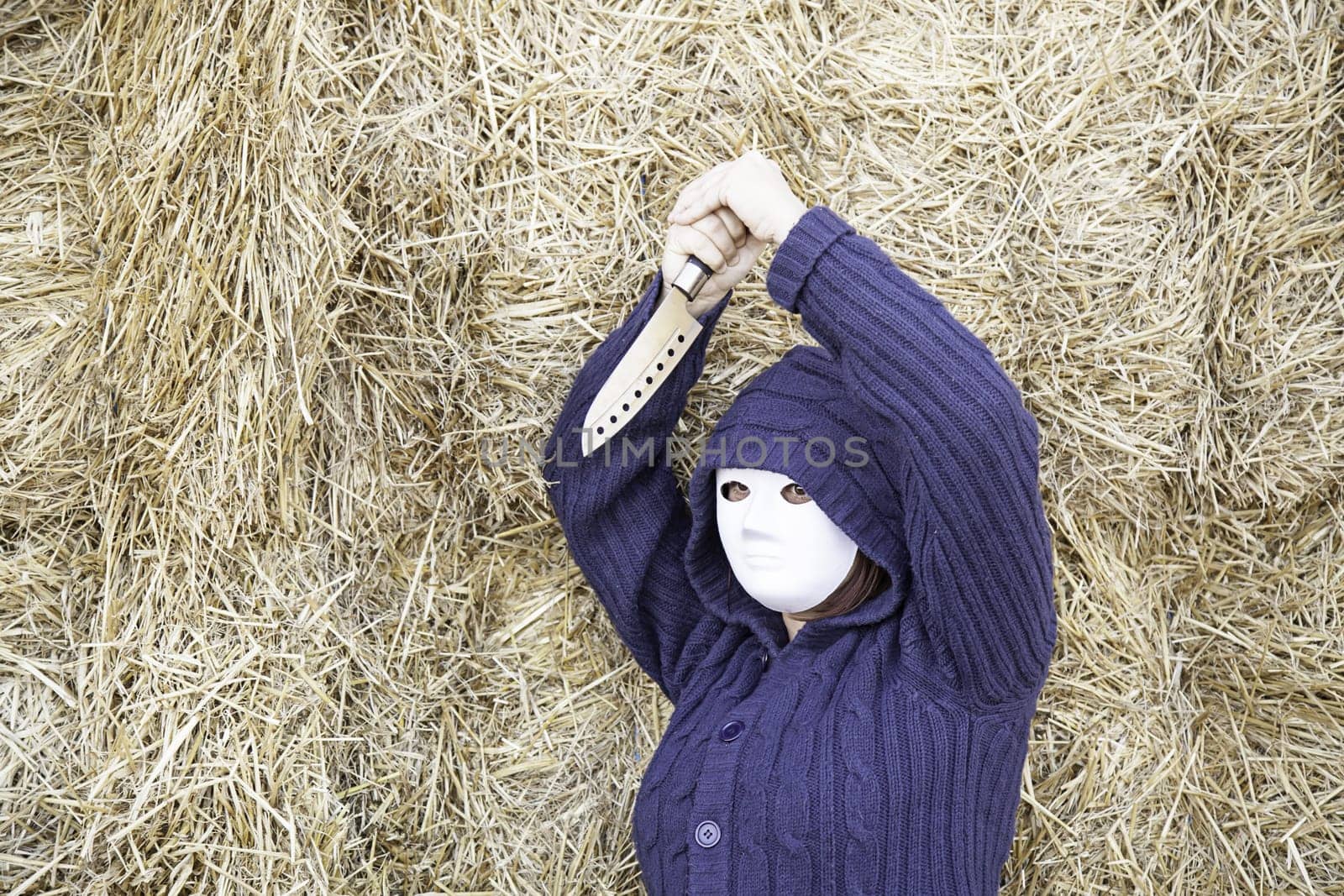 Masked woman in barn farm, halloween